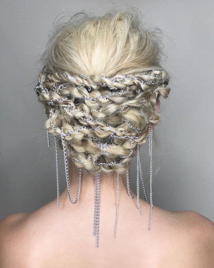 The-Chicest-Holiday-Hairstyles-to-Celebrate-in-Style-braided-updo-decorated-with-chains