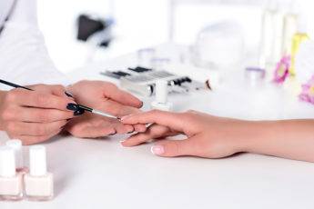 how-to-choose-the-best-nail-salon-woman-getting-a-manicure