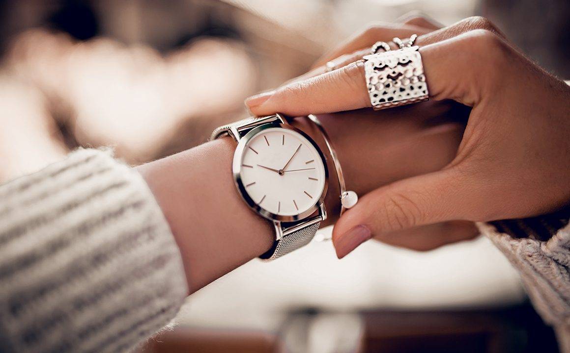 elegant-watch-woman-looking-at-beautiful-watch-on-her-wrist