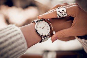 elegant-watch-woman-looking-at-beautiful-watch-on-her-wrist