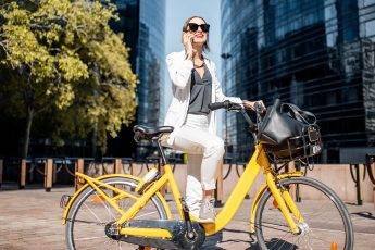 woman-with-yellow-electric-bike-outside-main-image