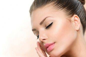 diy-dermatologist-approved-skin-treatments-for-radiant-skin-main-image-woman-holding-face