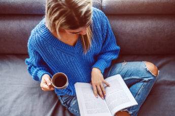 lifestyle-trends-that-will-be-big-in-2021-woman-sitting-with-coffee-and-a-book