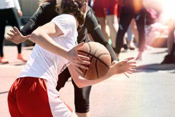 how-to-train-to-the-level-of-wnba-athlete-main-image-girls-playing-basketball