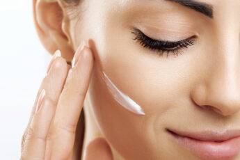 how-to-do-away-with-dark-circles-moisturizer-woman-applying-lotion-on-face