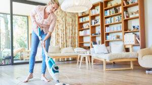 important-priducts-to-keep-your-home-clean-woman-swiffering-mopping-floor