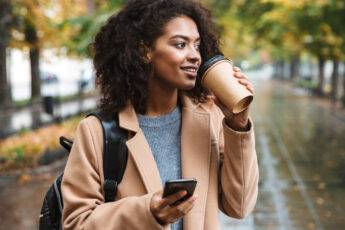 staying-safe-while-dating-online-beautiful-woman-with-coffee-on-phone-1000x600