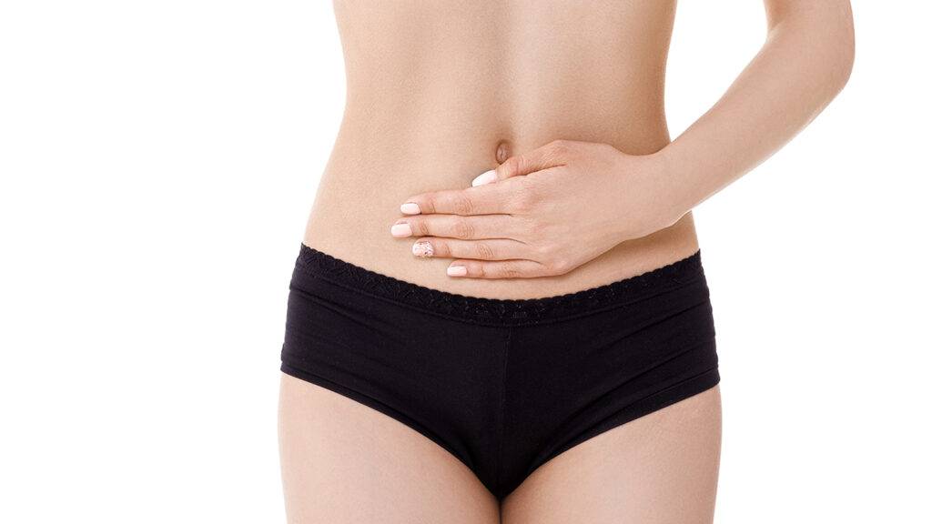 cutting-edge-technique-behind-liposuction-main-image-skinny-woman-holding-belly