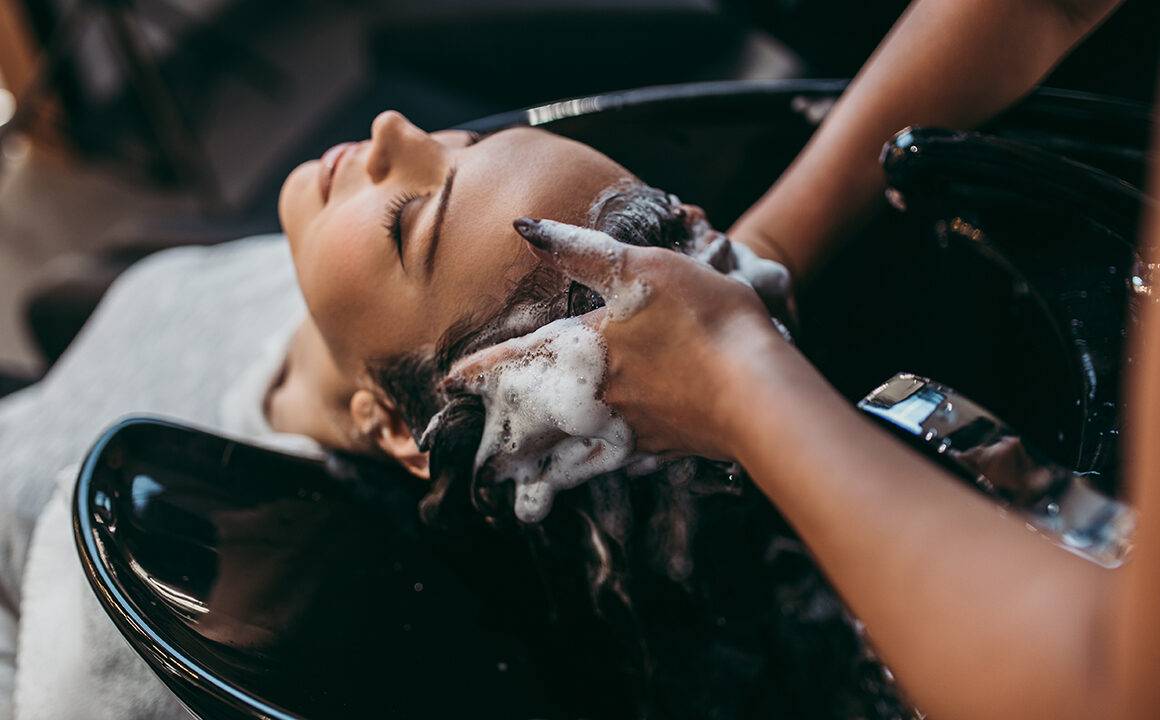 tips-to-receive-customer-retention-beauty-hair-business-someone-getting-hair-washed-at-salon