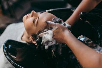 tips-to-receive-customer-retention-beauty-hair-business-someone-getting-hair-washed-at-salon