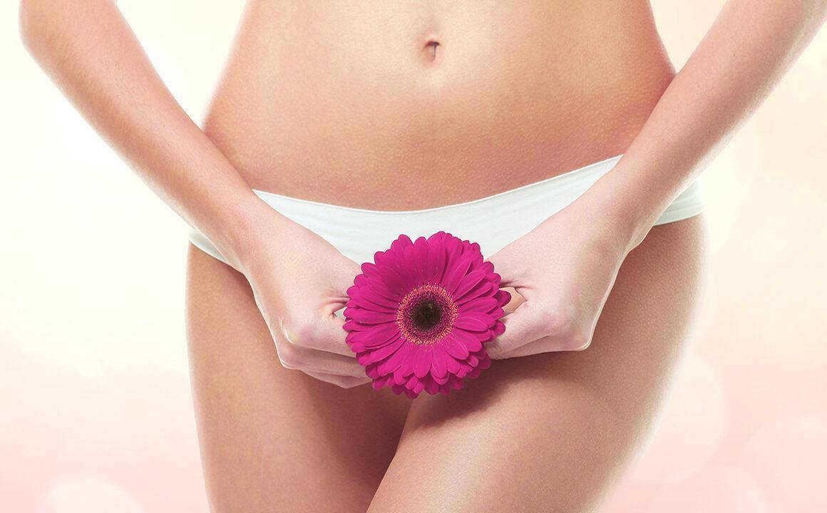 what-is-vaginal-rejuvenation-woman-holding-flower-up-to-vagina