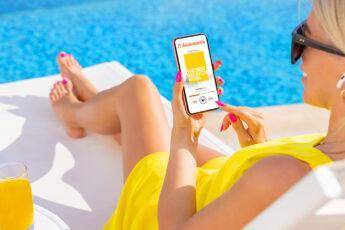 best-audio-books-for-iphone-woman-relaxing-by-pool