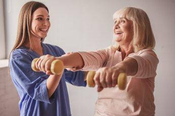 finding-care-for-elderly-relatives-woman-helping-older-woman-work-out