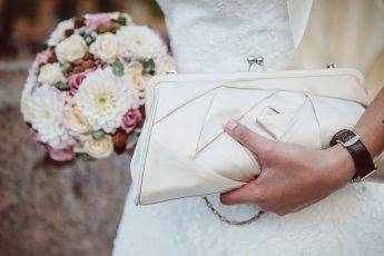 bride-at-wedding-with-white-clutch-bag-main