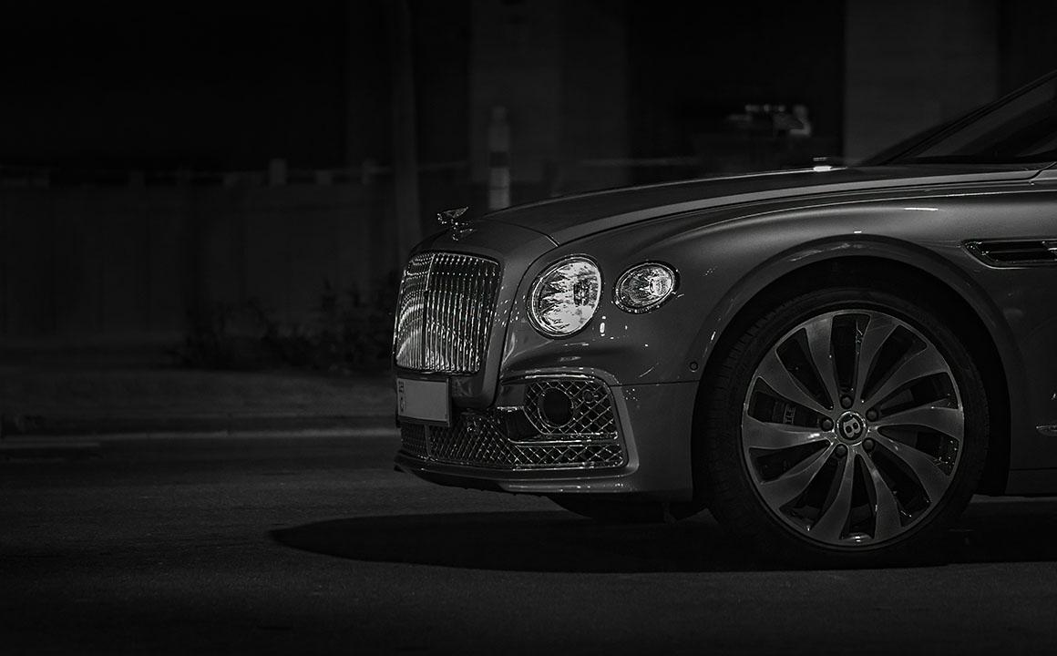 black and white photo of luxury vehicle